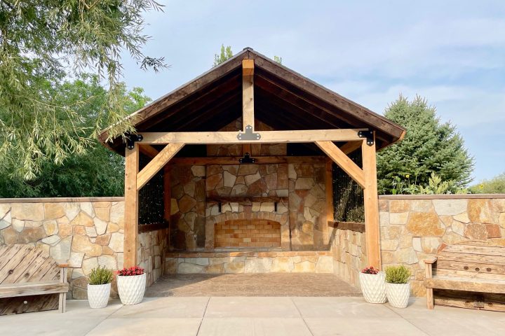 a wooden bench in front of a brick building