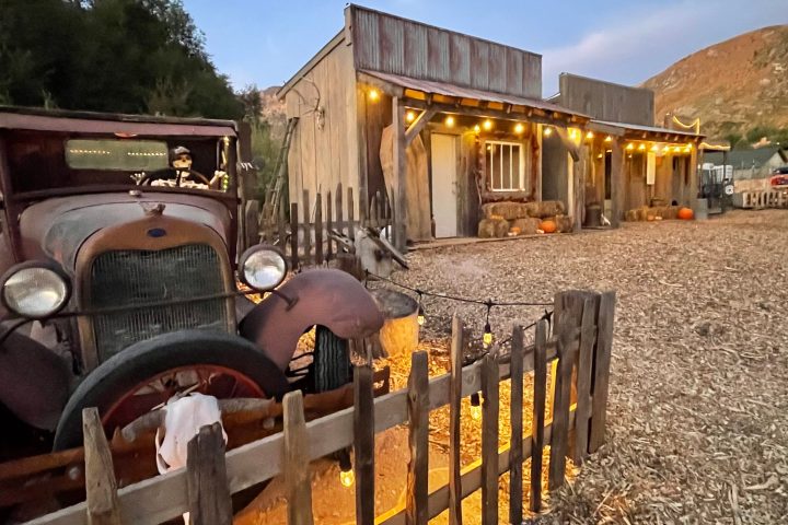 a truck that is sitting in front of a building