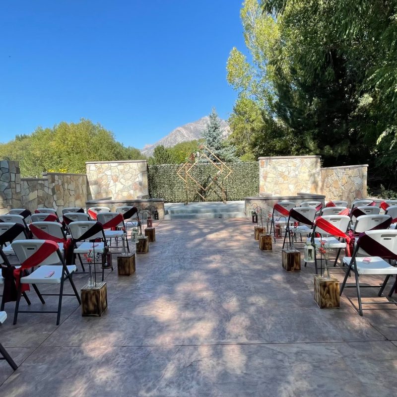 a group of people sitting at a picnic table