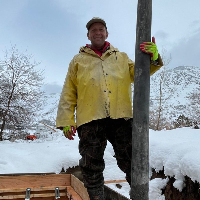 a man that is standing in the snow