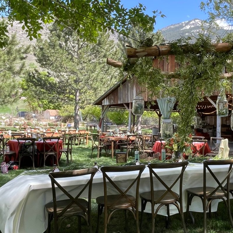a group of lawn chairs sitting on top of a picnic table