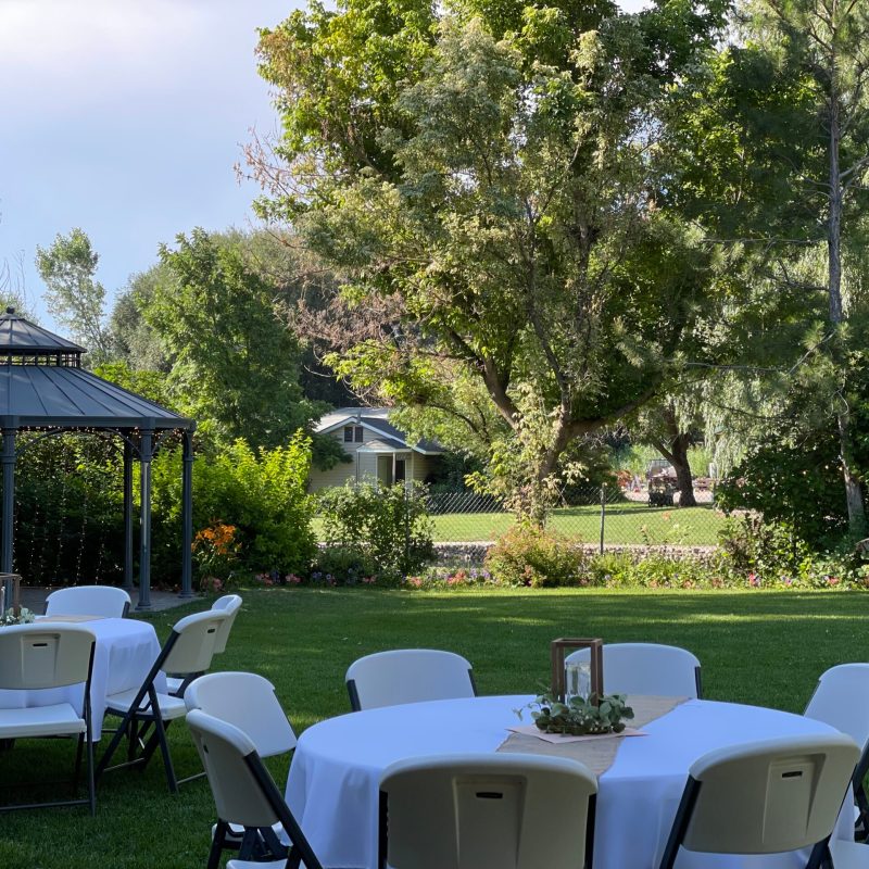 a group of lawn chairs sitting on top of a picnic table