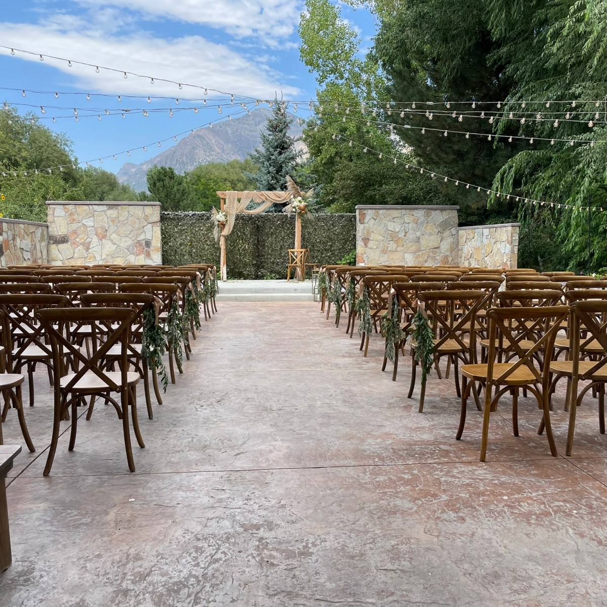 an empty park bench next to a body of water